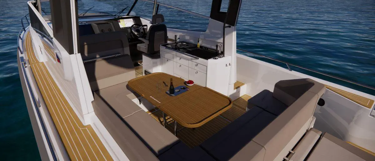 Stylish boat interior featuring a dining table, seating, and a kitchenette, with calm waters in the background.
